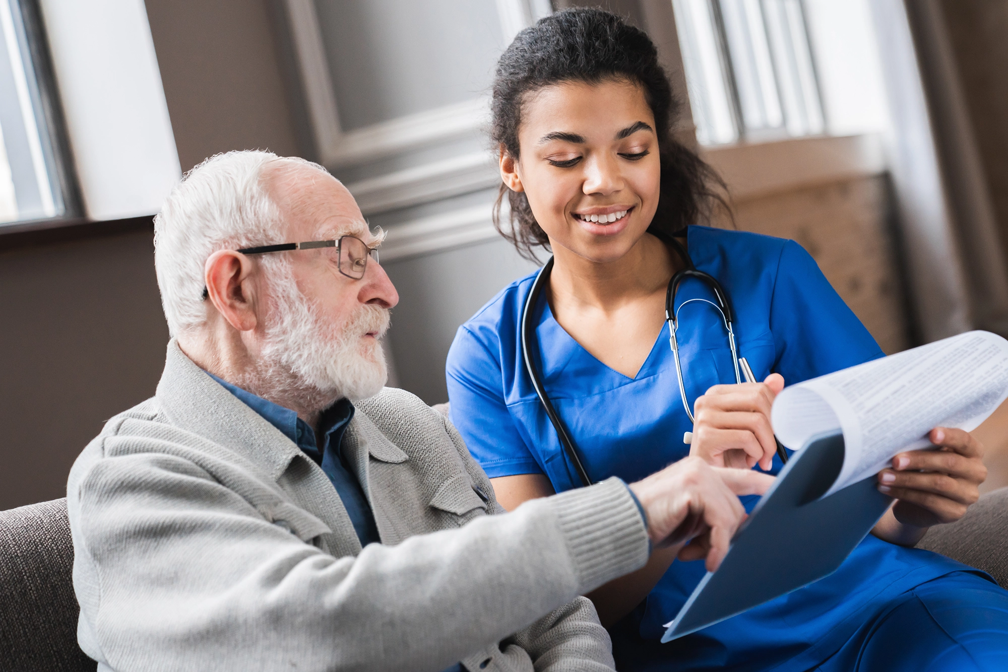 Photo of health care worker with patient