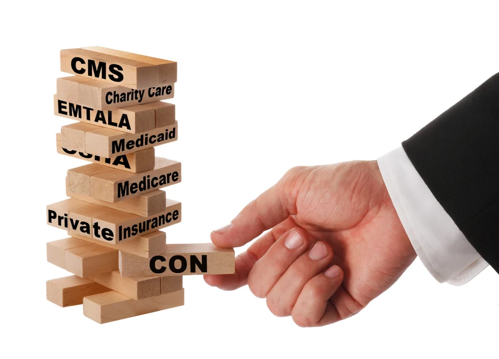 Photo of businessman with jenga tiles labeled with Certificate of Need language