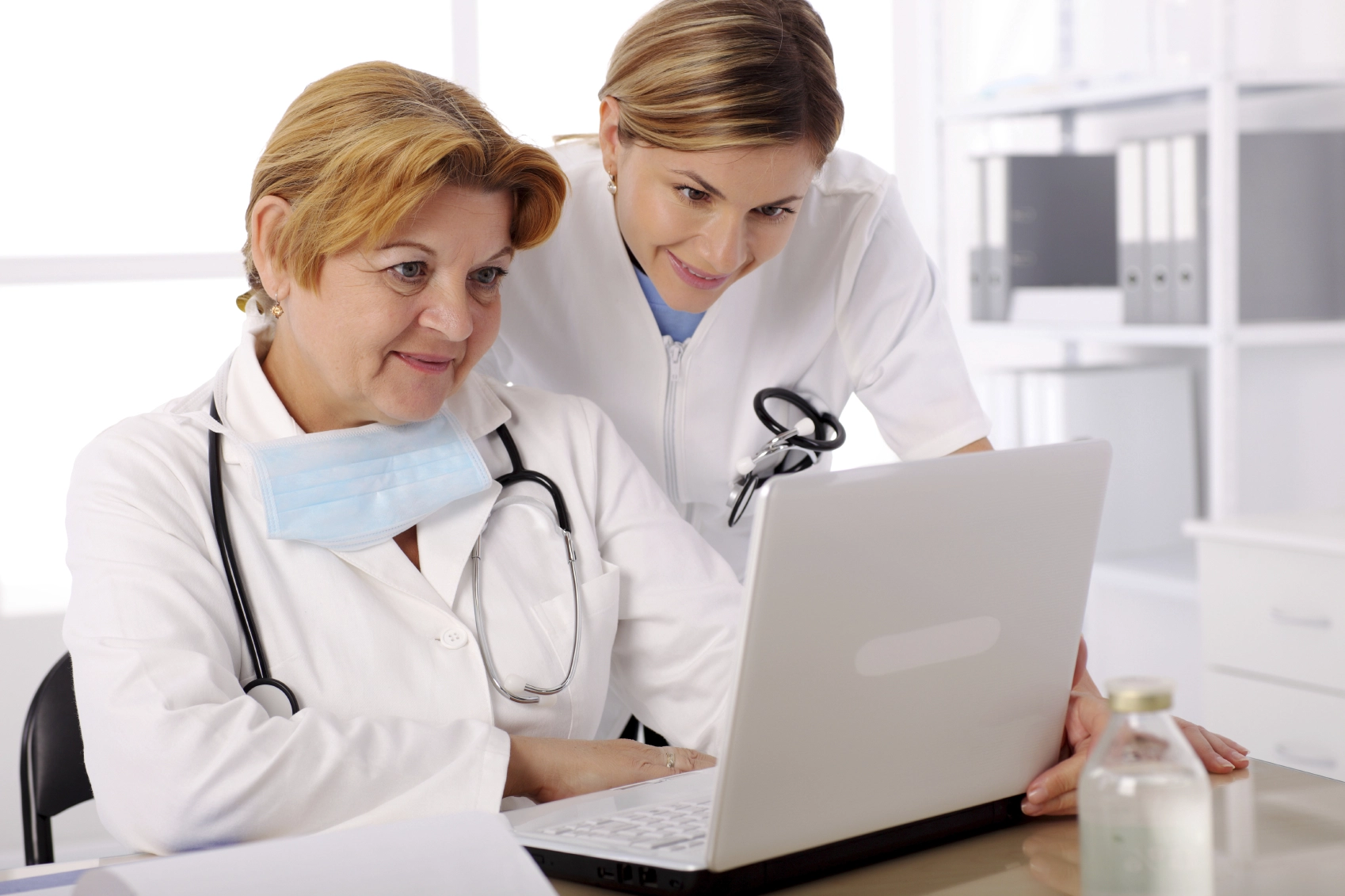Photo of health care workers using computer