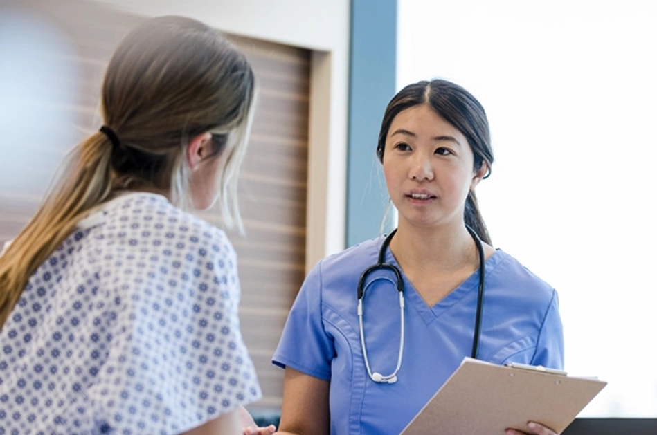 Nurse speaking with patient