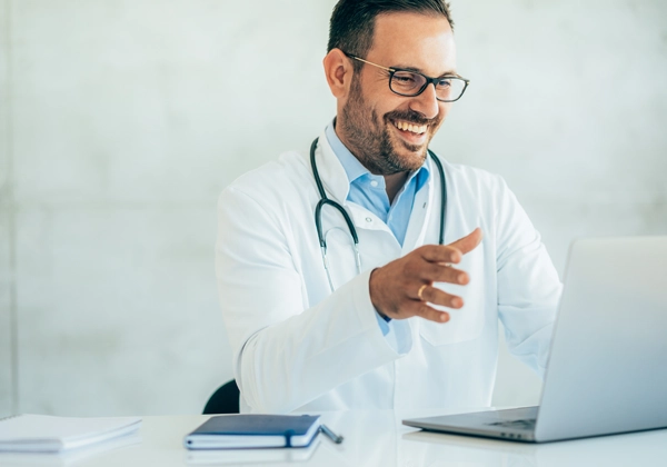 Photo of doctor attending an online meeting